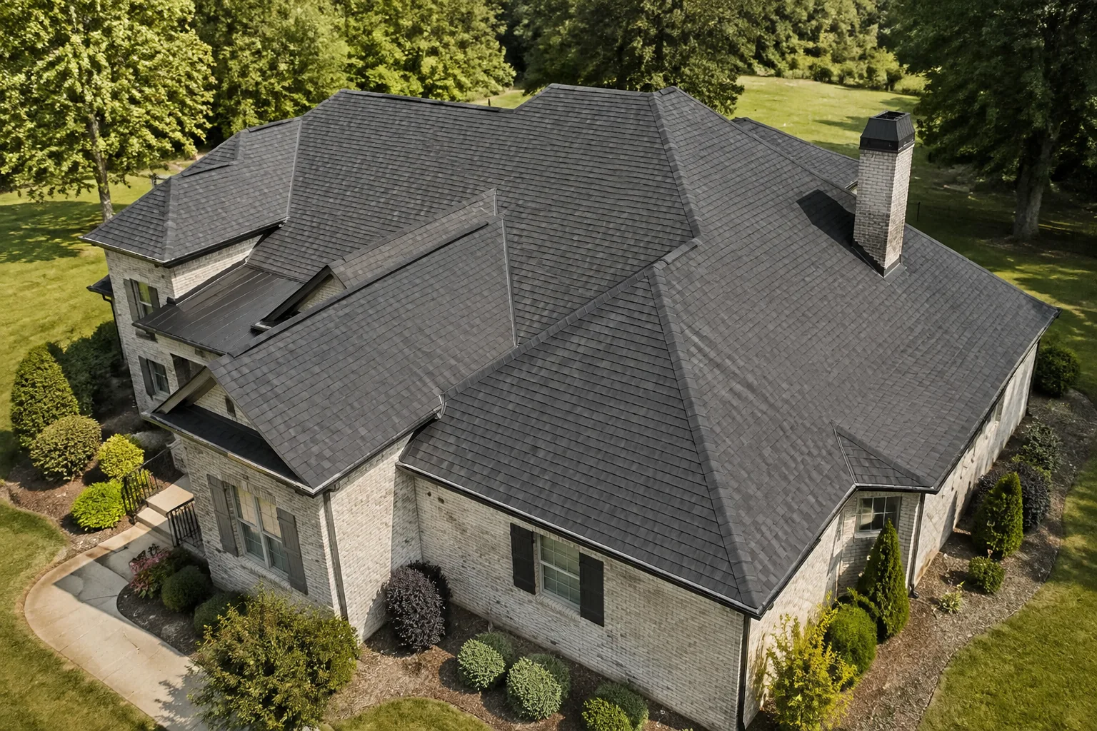 Aerial view of a charcoal shingle roof on a brick house